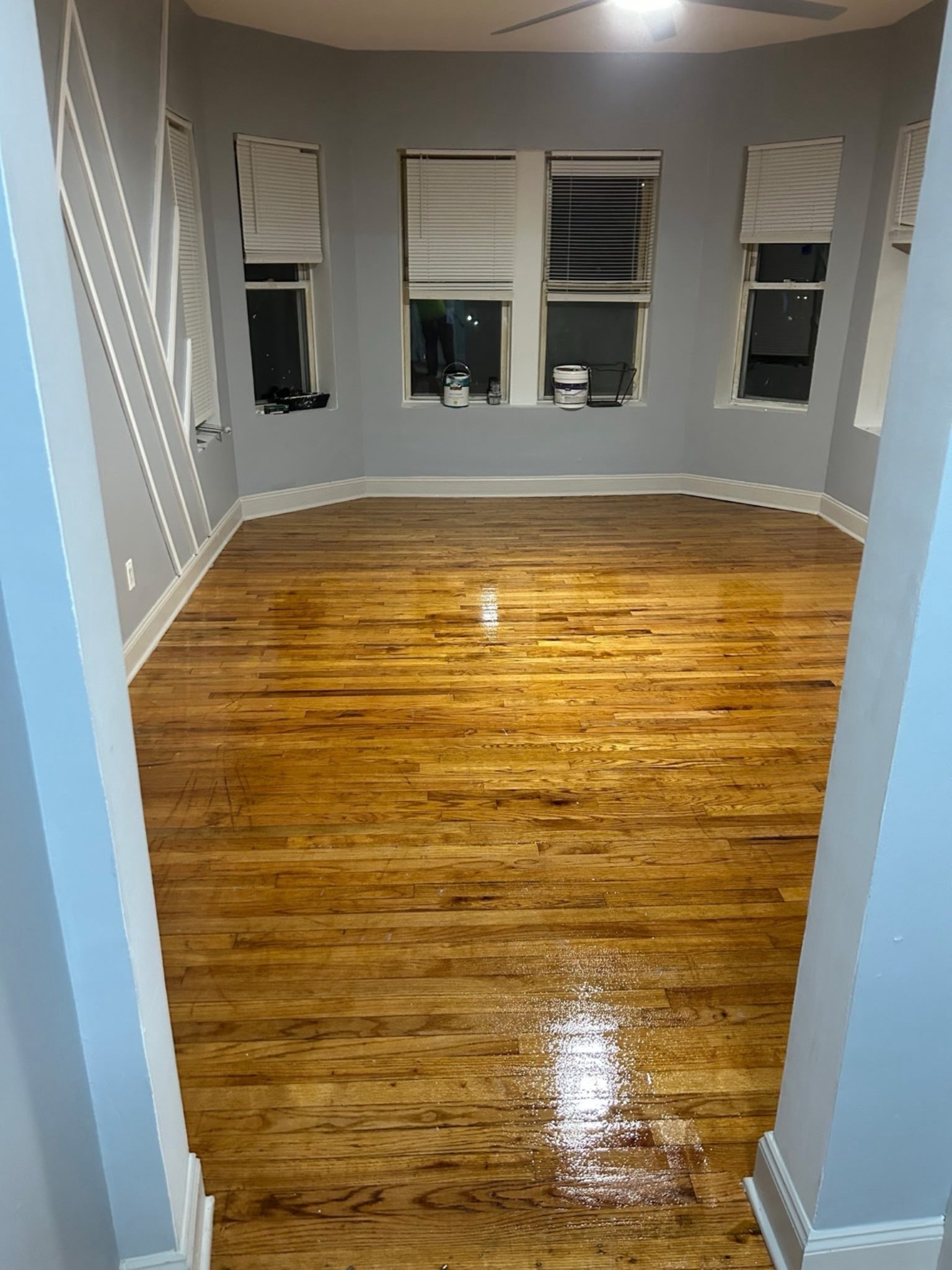 Open living / dining area with bay windows